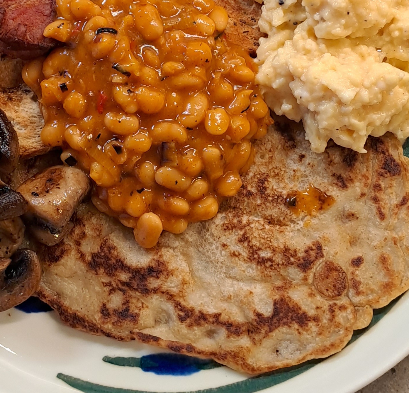 Derbyshire oatcakes, baked beans, scrambled egg and mushrooms