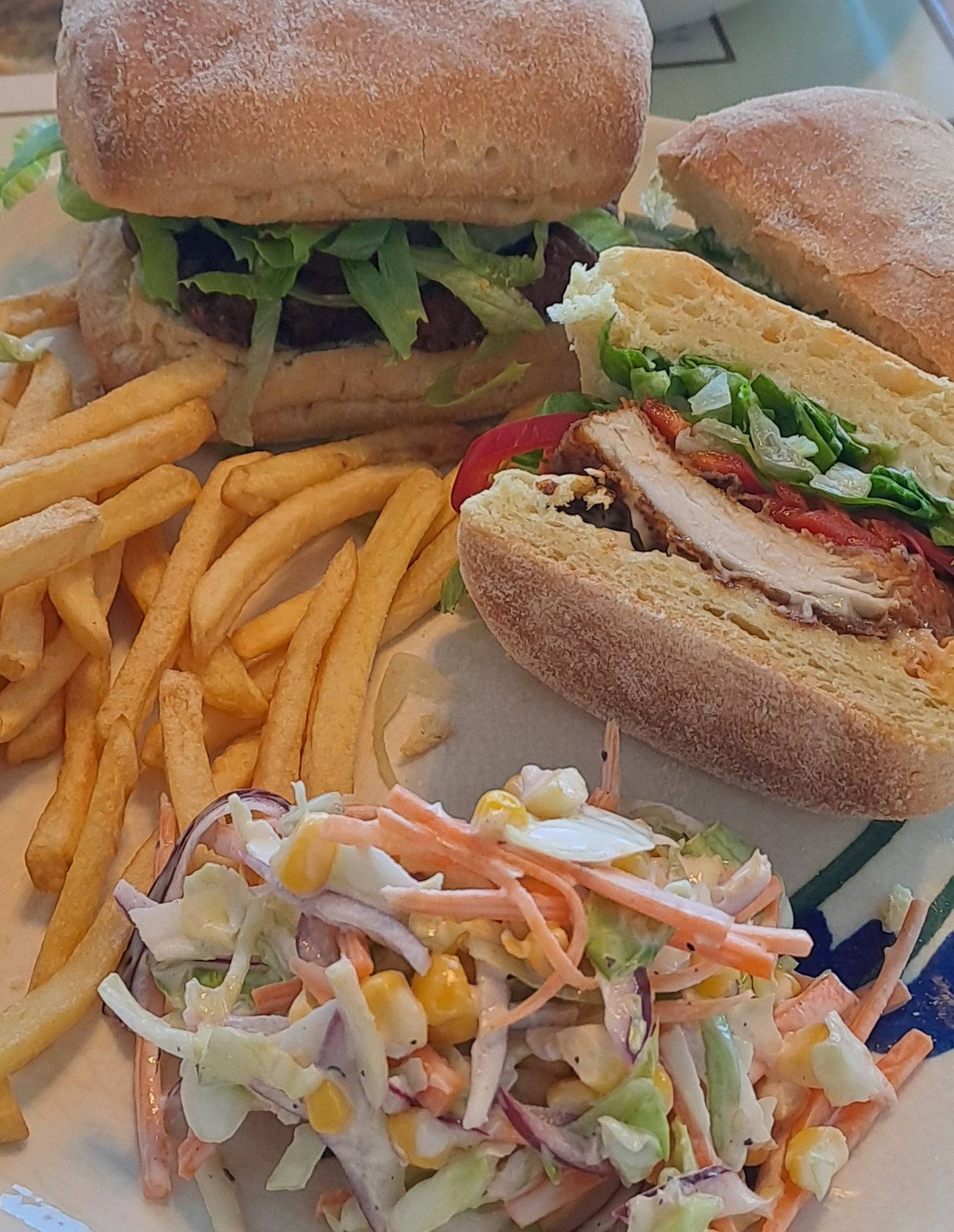 Spicy chicken burger, chips and coleslaw